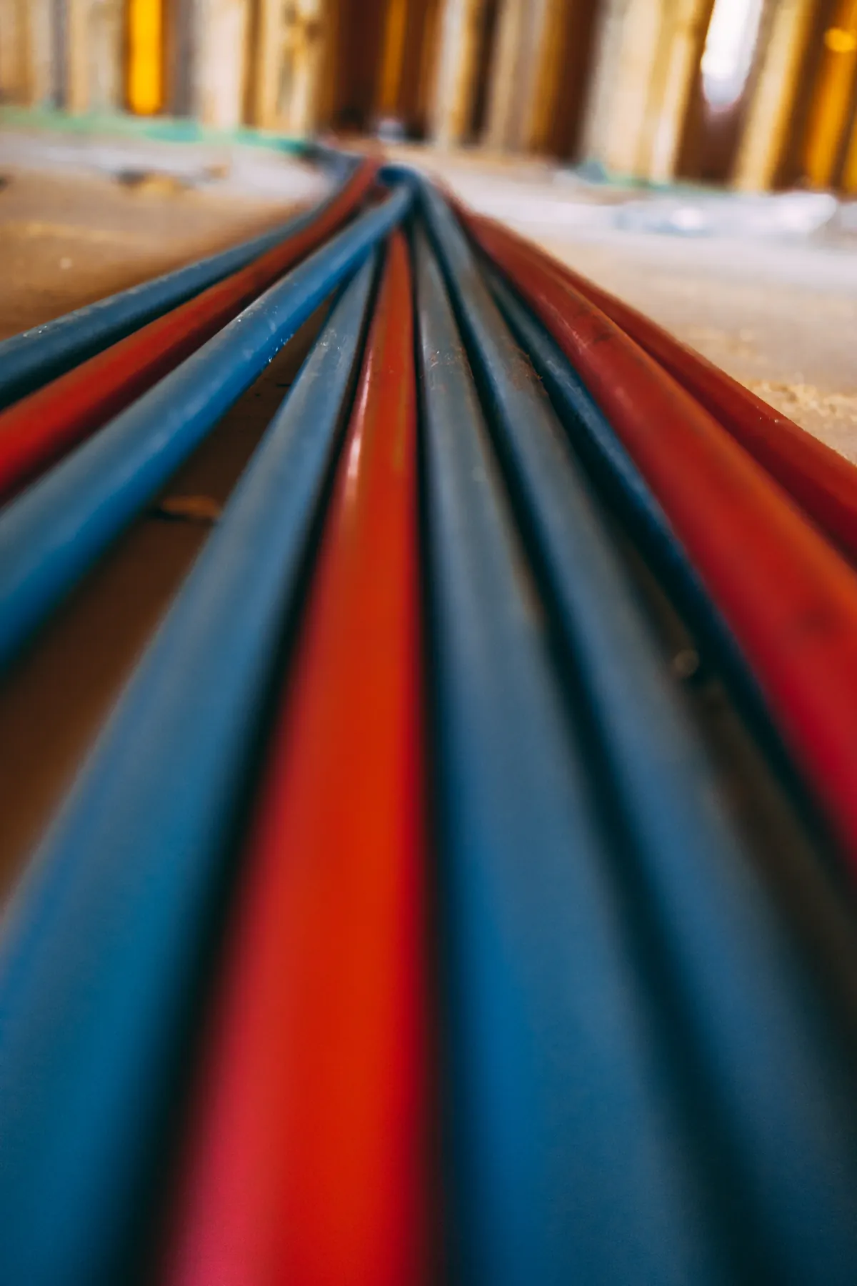 Coiled red and blue PEX tubing ready for a repipe – Replacing Your Tank for Tustin, CA homes